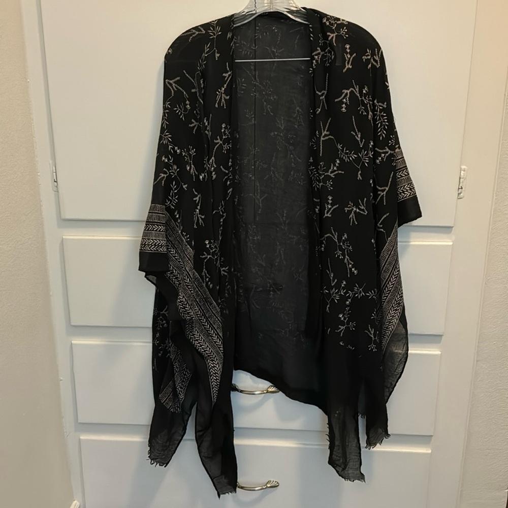 Light and sheer black shawl / cape.